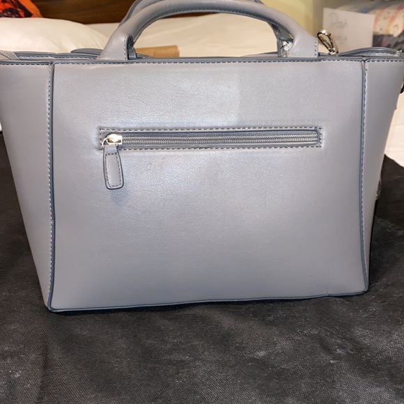 Purse with bow design on front. Brand new with tag. Gray purse. - Picture 11 of 16